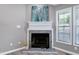 Close-up of the living room fireplace with decorative mantel and neutral wall color at 1443 Smokey Mountain Dr, Zebulon, NC 27597