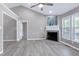 Spacious living room with a fireplace, ample natural light, and updated flooring at 1443 Smokey Mountain Dr, Zebulon, NC 27597