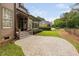 Spacious backyard featuring a large patio, screened in porch, and well-maintained lawn at 1508 Samuel Wait Ln, Wake Forest, NC 27587