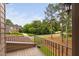 Balcony with wrought iron railing, and a view of the front lawn and street at 1508 Samuel Wait Ln, Wake Forest, NC 27587