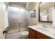 Bathroom vanity and shower with glass doors at 1508 Samuel Wait Ln, Wake Forest, NC 27587