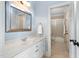 Bright bathroom showcasing a sink with chrome fixtures, custom cabinets, and an adjacent lavatory at 1508 Samuel Wait Ln, Wake Forest, NC 27587