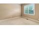 Bright bedroom features neutral paint, carpet, and natural light from the window at 1508 Samuel Wait Ln, Wake Forest, NC 27587