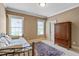 Cozy bedroom with natural light from two windows and a decorative rug create a welcoming atmosphere at 1508 Samuel Wait Ln, Wake Forest, NC 27587