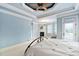 Spacious bedroom with fireplace, ceiling fan, and a door to the backyard at 1508 Samuel Wait Ln, Wake Forest, NC 27587