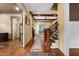Spacious foyer with hardwood floors, elegant staircase, and detailed trim work provides a warm welcome at 1508 Samuel Wait Ln, Wake Forest, NC 27587