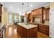 Gourmet kitchen with island, granite countertops, custom cabinets, and eat-in breakfast nook at 1508 Samuel Wait Ln, Wake Forest, NC 27587