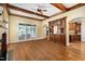 Open living room with hardwood floors, wooden ceiling beams, wet bar, and ample natural light at 1508 Samuel Wait Ln, Wake Forest, NC 27587