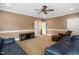 Comfortable living room features two couches, a wooden accent chair, and plush carpet at 1508 Samuel Wait Ln, Wake Forest, NC 27587