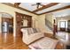 Elegant living room boasting hardwood floors, coffered ceilings, and a built-in bar area at 1508 Samuel Wait Ln, Wake Forest, NC 27587