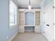 Charming office space with custom built-in shelving, drawers, and ample natural light at 1508 Samuel Wait Ln, Wake Forest, NC 27587