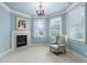 Sitting room features a fireplace and bright windows at 1508 Samuel Wait Ln, Wake Forest, NC 27587