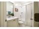 Well-lit bathroom with a shower-tub combo, single sink vanity, and nautical-themed accents at 151 Monteith Dr, Chapel Hill, NC 27516