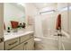 Bathroom featuring a shower-tub combo, granite vanity, and modern fixtures at 151 Monteith Dr, Chapel Hill, NC 27516