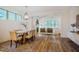 Spacious dining room boasts hardwood floors and a modern chandelier, open to the living area at 151 Monteith Dr, Chapel Hill, NC 27516