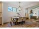 Spacious dining room boasts hardwood floors and a modern chandelier, open to the living area at 151 Monteith Dr, Chapel Hill, NC 27516