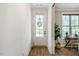 Bright entryway with a view of the office and front door featuring a beautiful wreath at 151 Monteith Dr, Chapel Hill, NC 27516