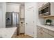 Kitchen features stainless appliances, white cabinets and countertops, and a walk-in pantry at 151 Monteith Dr, Chapel Hill, NC 27516