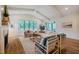 Bright living room boasts a fireplace, vaulted ceilings, and multiple windows with wooded views at 151 Monteith Dr, Chapel Hill, NC 27516