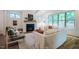 Bright living room boasts a fireplace, vaulted ceilings, and multiple windows with wooded views at 151 Monteith Dr, Chapel Hill, NC 27516
