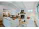 Bright, stylish living room with white sofas, modern fireplace, and open access to the kitchen at 151 Monteith Dr, Chapel Hill, NC 27516
