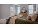 Serene main bedroom showcasing natural light and a glimpse into the en-suite bathroom at 151 Monteith Dr, Chapel Hill, NC 27516