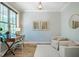 Cozy home office with ample natural light, a desk, comfortable seating and stylish decor at 151 Monteith Dr, Chapel Hill, NC 27516