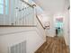 Elegant staircase with wood and white finishes, leading to the upper level of the home at 151 Monteith Dr, Chapel Hill, NC 27516