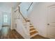 Bright staircase with wooden treads and white risers leading to the second floor at 151 Monteith Dr, Chapel Hill, NC 27516