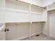 Spacious walk-in closet with ample shelving and rods for all your storage needs at 151 Monteith Dr, Chapel Hill, NC 27516