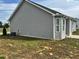 The back exterior of the house with minimal landscaping, showing the back of the house at 152 Springtooth Dr, Zebulon, NC 27597