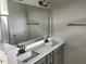 Bathroom featuring a double sink vanity with white countertops and gray cabinets at 152 Springtooth Dr, Zebulon, NC 27597