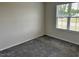 Bedroom featuring neutral walls, plush gray carpets, and a window at 152 Springtooth Dr, Zebulon, NC 27597