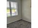 Bedroom featuring neutral walls, plush gray carpets, and natural light at 152 Springtooth Dr, Zebulon, NC 27597
