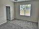 This bedroom features neutral walls and plush gray carpeting at 152 Springtooth Dr, Zebulon, NC 27597