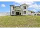 Enjoy this beautiful backyard with a covered patio, spacious lawn, and stylish home exterior at 159 Mitchell Manor Dr, Angier, NC 27501