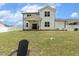 This backyard boasts a covered patio and spacious, lush yard, perfect for relaxation and outdoor enjoyment at 159 Mitchell Manor Dr, Angier, NC 27501