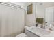Clean bathroom with white vanity, white countertop, framed mirror, and shower with curtain at 159 Mitchell Manor Dr, Angier, NC 27501