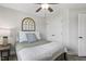 Bright bedroom boasts a plush bed, natural light, and an updated ceiling fan at 159 Mitchell Manor Dr, Angier, NC 27501