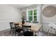 Bright dining room with large window and stylish decor, ideal for Gathering meals and entertaining at 159 Mitchell Manor Dr, Angier, NC 27501