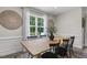 Bright dining room with large window and stylish decor, ideal for Gathering meals and entertaining at 159 Mitchell Manor Dr, Angier, NC 27501