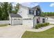 Spacious two-car garage complementing a well-maintained home with an American flag and manicured greenery at 159 Mitchell Manor Dr, Angier, NC 27501