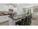 Modern kitchen island with sleek black countertops and seating, perfect for casual dining at 159 Mitchell Manor Dr, Angier, NC 27501