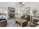 Inviting living area with a stone fireplace, hardwood floors, comfortable sofas, and stylish decor at 159 Mitchell Manor Dr, Angier, NC 27501