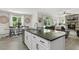 Open-concept living space seamlessly connecting the kitchen, dining area, and living room at 159 Mitchell Manor Dr, Angier, NC 27501
