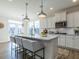 Stylish kitchen island with stainless steel appliances and lots of natural light at 162 Sugar Pine Drive, Franklinton, NC 27525