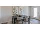 Contemporary dining area with a black table and upholstered chairs under modern art at 169 Holton St, Smithfield, NC 27577