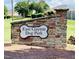 East Clayton Dog Park sign with a stone base and dog bone graphic at 174 Ripple Way # 324, Clayton, NC 27520