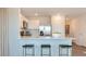 Open kitchen with modern appliances, white cabinetry, and a breakfast bar with stool seating at 177 Holton St, Smithfield, NC 27577
