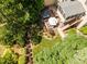 Aerial view of a backyard featuring a hot tub, screened porch, deck stairs, and outdoor dining area at 1952 Combine Cir, Apex, NC 27502